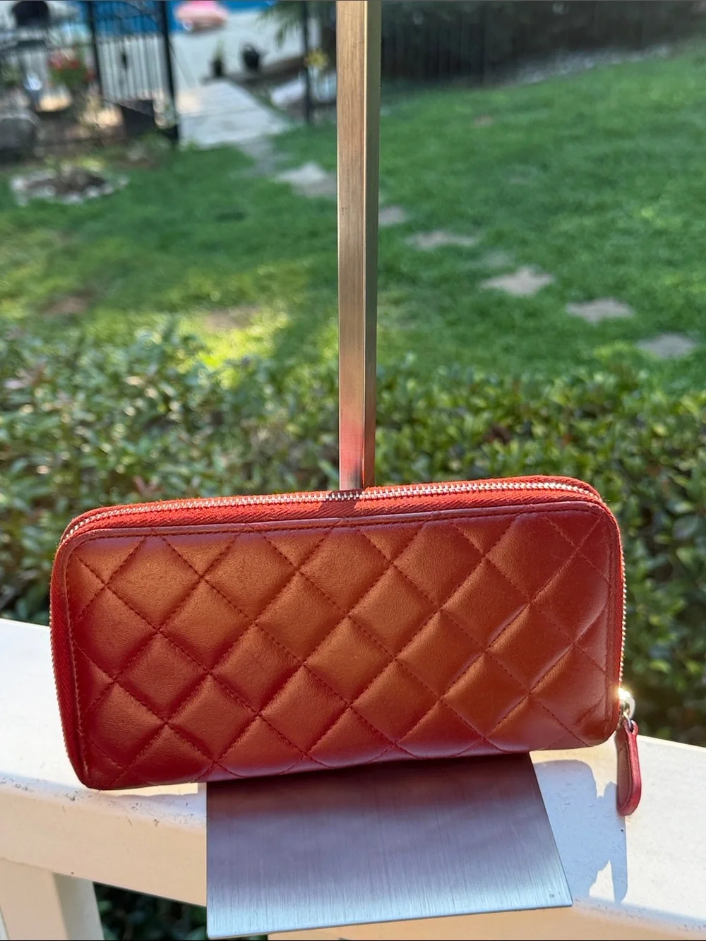 CHANEL Authenticated Quilted Caviar Leather Zip-Around Wallet in Burgundy/red